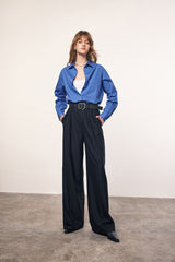 MADENAM. Miu Miu style. Oversize shirt. Navy. White. Pointed collar with button. Botton front closure. Adjustable button cuffs. Style with bralette. Short Skirt. Wide leg pants. Available in size XS, S, M, L