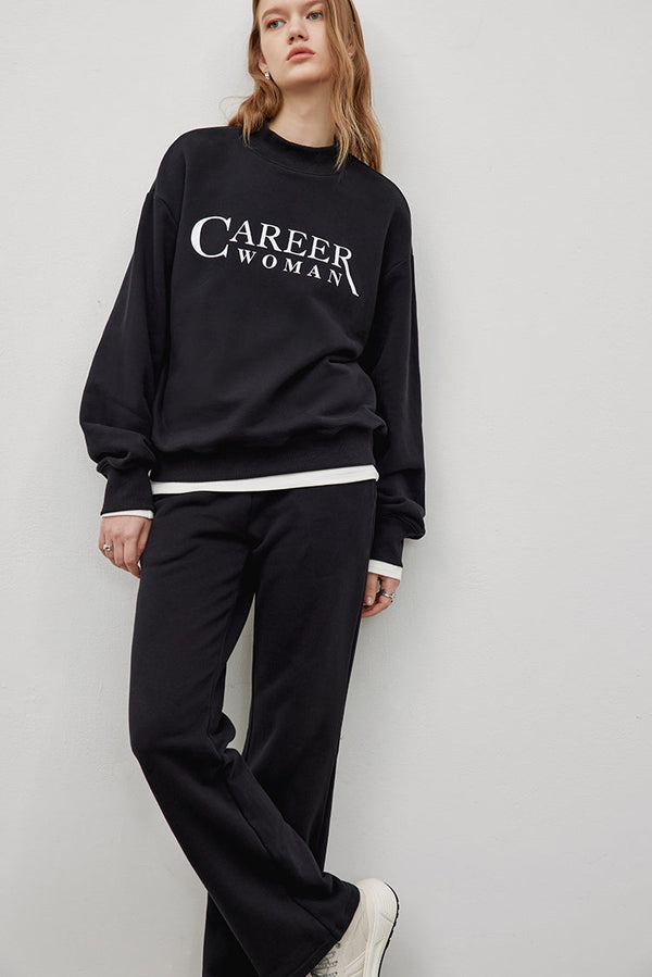 MADEINAM. Career Women front slogan sweat pants. Rib knit collar. Side Pockets. Straight leg cut. Down string tie. Hailey Bieber Style. Athflow.  Available in size XS, S, M, L.