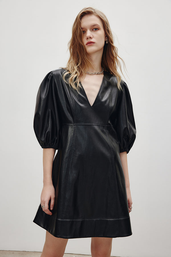 MADEINAM Ballon Sleeve Leather Dress. Faux Leather. Black. Ganni Sytle. Soft faux leather Mini length A-line silhouette V-neck Elasticated elbow length ballon sleeves. Available in size XS, S, M, L