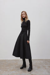 MADEINAM A Line Skirt. Black A-line silhouette. Above ankle. Concealed side zip closure. Match up fit knit top. Top up with a long MADEINAM trench coat. Available in size XS, S, M,  L.