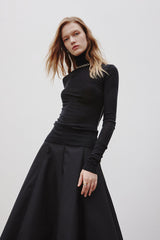 MADEINAM A Line Skirt. Black A-line silhouette. Above ankle. Concealed side zip closure. Match up fit knit top. Top up with a long MADEINAM trench coat. Available in size XS, S, M,  L.